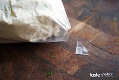 a bag of food sitting on top of a wooden table