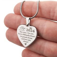 Looking for a meaningful custom gift for her? Then look no further than this beautiful made-in-the-USA necklace with personalized engraving!   The design shown is laser engraved on the front and the back can be upgraded to have a custom name, date, or short message, added for an extra personal touch!   Proudly customized and shipped from Florida 🇺🇸 in a complimentary gift box, this is a keepsake present she is sure to love! ----------------------------------------------------------- ➜ PERSONALIZE IT! Upgrade to engrave a custom name, date, or cute message, on the back for an extra sentimental touch!  If you would like to add engraving, please be sure to: 1) Select "yes" in the engraving box 2) Enter your text of choice in the "Add your personalization" section  -------------------------- Grad Jewelry, Phd Graduation, Doctorate Degree, Graduation Necklace, Doctorate, Short Message, Cute Messages, Class Of 2024, Necklace Gift