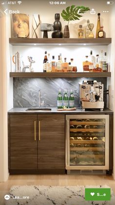 an image of a kitchen with wine bottles on the shelves