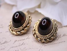 Vintage West Germany gold tone oval clip on earrings Brown cabochon clip on Dimensions - 2.6 * 2.2 cm /1.02 * 0.86 inches Signed - W. Germany This item is vintage, not new and may show some signs of wear or use.  Please ask questions if you have any doubt of an items condition.  ! Please make sure to review an item listing description carefully, examine photos, and read my 'Shipping Policies' before making your purchase. Luxury Oval Cabochon Clip-on Earrings, West Germany, Clip On, Vintage Gold, Clip On Earrings, Gold Tones, Etsy Accessories, Jewelry Earrings, Accessory Gift