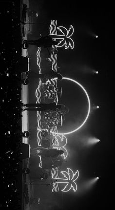 black and white photograph of lights reflecting in water