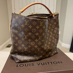 Authentic Pre-Loved Louis Vuitton Sully Mm. This Classic Lv Hobo In Monogram Canvas Has A Two-Way Zip Closure. There Is A Small Watermark In The Handle And Small Discoloration On The Canvas - Photo Included. Perfect Everyday Bag And Great For Travel. Includes Original Box And Dust Bag. Louis Vuitton Sully Bag, Lv Loop Hobo Bag, Louis Vuitton Bucket Bag Vintage, Louis Vuitton Brown Bag, Luxury Brown Monogram Print Bag, Canvas Photo, Bags Louis Vuitton, Louis Vuitton Bags, Everyday Bag