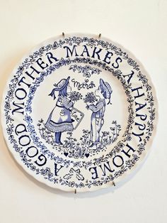 a blue and white plate that says another makes a happy day