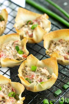 small appetizers are sitting on a cooling rack