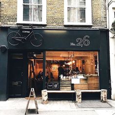 the store front of a bicycle shop with bicycles on display