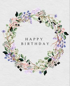 a watercolor wreath with the words happy birthday