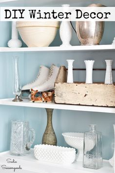 white shelves with vases and other items on them