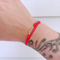 "Red String Surfer Bracelet Good Luck Gold Beads Silver Beads Bracelet Christmas Birthday New Year Gift Waterproof Surfer Beach Bracelet ❤ This item is made of 1mm high-quality red waxed cord with gold-filled beads or sterling silver beads (4mm) and a stainless lobster clasp. It is adjustable, the longest length is 18\", it fits everyone. ❤ It is a bracelet, it is also an anklet. ❤ This bracelet can be worn 24hours, even in the shower. It dries really fast. ❤ According to my testing, this bracel Adjustable Gold Beaded Bracelets For Holiday, Adjustable Red Bracelet For Birthday, Red Beaded Bracelets With Letter Beads For Birthday, Red Beaded Bracelets For Birthday, Beach Bracelet, Good Luck Bracelet, Armband Gold, Surfer Bracelets, Bracelet Christmas