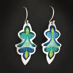 Teal and Blue Artemis Dangle Earrings - cloisonne and champleve vitreous enamels w/ sterling silver ear wires handmade by Sandra McEwenFeel like a goddess in these lovely Cloisonné and Champlevé enamel earrings!Dimensions: 18mm x 36mmMaterials: Vitreous Enamels on fine silver.  Sterling silver ear wires.Did you know that enamels are melted glass?  Yes!  It's true...  To create this lovely pair of earrings, I first fabricated the silver base out of sheets of fine silver.  The lines of the design Vitreous Enamel, A Goddess, Enamels, Enamel Earrings, Silver Wire, Fine Silver, Ear Wires, Dangle Drop Earrings, Dangle Earrings