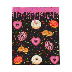 there are many donuts and sprinkles on this black paper towel that says happy birthday