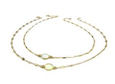 "Our beautiful petite Opal Choker Necklace showcases an oval shimmering opal with flecks of sparkle and opalescent colors. The beauty of the simulated opal is that it will take on the hue of any color you are wearing. Your choice of flattened double bar sequin chain which reflects the light like little mirrors or a petite single bar chain (shown on model) . * 14K gold filled chain and findings, made to last a lifetime. * Simulated Opal measure approx. 6mm x 8mm in size and surrounded by a vermei Adjustable Dainty Oval Necklace, Adjustable Oval Dainty Necklace, Dainty Oval Adjustable Necklace, Gold Opal Necklace With Oval Cabochon, Delicate Choker Necklace, Opal Choker, Delicate Choker, Choker Necklace Gold, Stone Choker