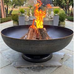 a fire pit sitting on top of a stone floor