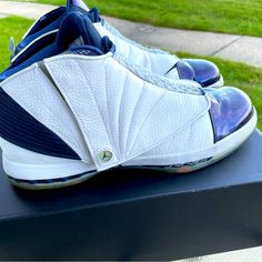 The Air Jordan 16 Retro Midnight Navy 2016 Is A Particular Colorway Of The Air Jordan 16 Retro Featuring A Blend Of White And Midnight Navy. The Shoe’s Upper Is Constructed Using Leather And Synthetic Materials And Features A White Base With Midnight Navy Accents On The Toe-Cap And Around The Ankle. The Midsole Incorporates Nike’s Air Zoom Technology In The Forefoot And Heel For Cushioning And Impact Absorption During Activities. It Also Has A Carbon Fiber Shank Plate For Added Stability And Support. A Particular Detail That Our Experts Love About The Air Jordan 16 Retro Midnight Navy 2016 Is Its Unique Shroud System. The Shoe Has A Removable Magnetic Shroud That Covers The Laces And Jordan 16, Navy Accents, Jordan White, December 22, Synthetic Materials, Jordans For Men, Midnight Navy, Air Zoom, Shoes Casual