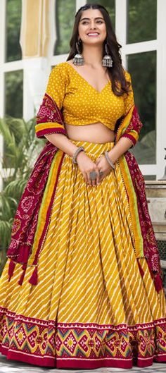 Yellow color Lehenga in Tussar Silk fabric with Bandhej, Lehariya, Printed work Yellow Katan Silk Lehenga For Navratri, Navratri Yellow Lehenga With Floral Embroidery, Navratri Yellow Raw Silk Lehenga, Navratri Yellow Meenakari Choli, Navratri Yellow Organza Choli, Navratri Lehenga, Engagement Reception, Reception Lehenga, Waist Chain