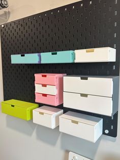 several boxes are lined up on the wall