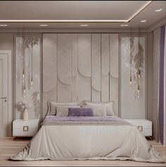 a large white bed sitting in a bedroom on top of a hard wood floor