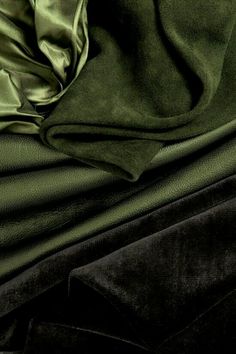 green and black fabric folded together on top of each other