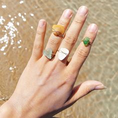 Handmade wure wrapped rings with recycled seashells and sea glass found on florida beaches. These rings are made with 18k gold filled wire so they are naturally water proof and will not tarnish. Select your correct ring size for purchase. Gold Ocean-inspired Rings For Beach, Adjustable Ocean-inspired Sea Glass Jewelry, Beach Jewelry With Hand Wrapped Sea Glass, Minimalist Beach Ring Jewelry, Minimalist Beach Jewelry Ring, Unique Gemstone Jewelry For The Beach, Hand Wrapped Sea Glass Jewelry For The Beach, Ocean-inspired Shell Rings For Beach, Hand-wrapped Sea Glass Jewelry For The Beach