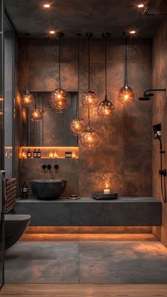 a bathroom with lights hanging from the ceiling