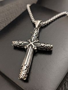 "Men's Stainless Steel Medieval Cross Necklace Viking Nordic Necklace Statement Pendant Necklace,  CHRISTMAS GIFT For Him Something for the curious, the wandering soul...make your mark! LIMITED QUANTITY AVAILABLE!!  MAKES THE PERFECT GIFT! IDEAL FOR ALL OCCASIONS, CHRISTMAS, BIRTHDAY, FATHER'S DAY, ANNIVERSARY!   Comes with a strong stainless steel 3 MM box chain, length of your choice!   Made from high-quality Stainless Steel, will not tarnish or change colour! Comes packed in a quality gift bo Vintage Engraved Cross Necklace Gift, Spiritual Stainless Steel Chain Necklace, Spiritual Metal Cross Necklaces, Symbolic Stainless Steel Cross Pendant Necklace, Gothic Stainless Steel Necklace With Oxidized Finish, Gothic Oxidized Stainless Steel Necklaces, Symbolic Antique Silver Stainless Steel Necklace, Gothic Engraved Cross Necklace, Gothic Engraved Stainless Steel Jewelry