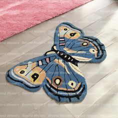 two butterfly shaped rugs on the floor