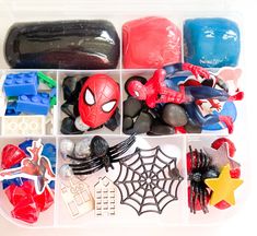 a plastic container filled with assorted spiderman toys