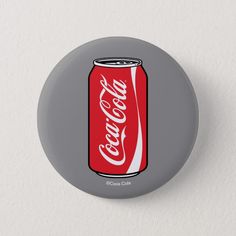 a button with a can of coca - cola on it