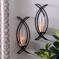 PRICES MAY VARY. Curved off center metal arms will add architectural detail to your walls. They'll turn any wall from dull to dramatic in no time! Set includes two (2) sconces. Two sconces in the set. Clear glass inserts included. Glass dimensions: 8 x 3 inches. Candles sold separately. Each sconce measures 6L x 4.25W x 18.5H in. Two sconces in box. Crafted of metal and glass. Black metal finish with clear glass. Designed, developed and manufactured by Holidaysmyway. Comes ready for wall mount; Metal Wall Candle Holders, Wall Sconces Living Room, Sconces Living Room, Metal Tree Wall Art, Wall Candle Holders, Candle Wall Sconces, Wall Candles, Decor Minimalist, Iron Decor