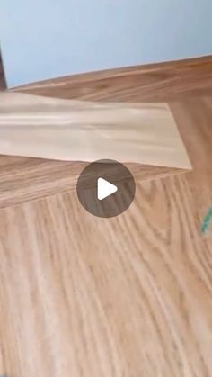 a video demonstrating how to use a sanding block on a wood floor with the help of a tape measure