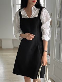 Style Pinafore Dress, Black Strap Dress With Shirt Under, Black Dress Shirt Underneath, Dress With A Shirt Under, Dress With Tshirt Under Outfits, Shirts Under Dresses Outfit, Blouse Under Dress Outfit, Pinafore Dress Black, White Shirt Black Dress Outfit