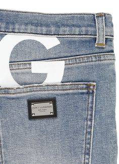 - Light blue Dolce & Gabbana cotton jeans for boy - Belt loops - Front button and zip fastening - Five pockets - Rear contrasting color logoed print - Rear metal logoed tabComposition: 98% Cotton, 2% Elastane Application:, 80% Polyester, 20% Zamak Blue Cotton Jeans With Logo Patch, Casual Denim Bottoms With Logo Print, Casual Straight Leg Jeans With Logo Print, Light Blue Dolce Gabbana, Boys Belt, Feminine Chic, Stefano Gabbana, Boys Bottoms, Printed Jeans