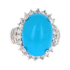 The Oval Cut Turquoise is 8.55 Carats and is surrounded by a Halo of beautifully set diamonds. There are 36 Round Cut Diamonds that weigh 1.15 Carats (Clarity: SI2, Color: F). The total carat weight of the ring is 9.70 Carats. The ring is crafted in 14 Karat White Gold and weighs approximately 12.1 grams Ring size = 7 (Free ring sizing upon request) Luxury Turquoise Jewelry With Center Stone, Elegant Blue Turquoise Ring With Center Stone, Luxury Oval Turquoise Gemstone Ring, Luxury Blue Multi-stone Turquoise Ring, Luxury Blue Turquoise Ring For Formal Occasions, Turquoise Blue Diamond Ring With Center Stone, Oval Diamond Turquoise Ring For Formal Occasions, Formal Oval Turquoise Ring With Diamond, Elegant Turquoise Ring With Center Stone