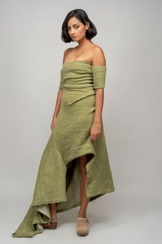 Olive green wool maxi dress in 100% wool base highlighting the draped asymmetrical off shoulder neckline and undone edges detailing. - Aza Fashions Green Maxi Length Off Shoulder Dress, Green Pre-draped Maxi Dress, Chic Green Maxi Dress With Draped Sleeves, Green Asymmetrical Neckline Pre-draped Dress, Green Fitted Maxi Dress With Draped Sleeves, Fitted Green Maxi Dress With Asymmetrical Neckline, Wool Maxi Dress, Blanket Dress, Studio Green