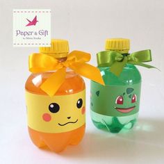 two plastic bottles with different designs on them, one has a yellow bow and the other is green