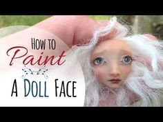 a doll with white hair and blue eyes is shown in front of the words how to paint a doll face