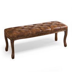 a bench made out of wood with leather upholstered on the top and legs