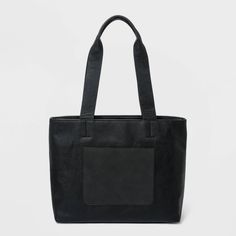 Whether headed to office or running errands during off-duty days, this Large Tote Handbag from Universal Thread™ will carry your essentials in style. This tote handbag in chic, classic black features a large shape that provides plenty of room to keep your keys, phone, wallet and other small essentials close at hand and neatly organized. The double handle makes for easy and comfy carrying, while multiple interior and exterior pockets let your store your stuff the way you want. Versatile and simpl Black Functional Satchel For Office, Functional Black Office Satchel, Trendy Black Laptop Bag With Double Handle, Versatile Black Tote Bag, Functional Shoulder Bag With Top Carry Handle For Work, Functional Black Shoulder Bag For Office, Functional Office Bag With Top Carry Handle, Functional Black Office Travel Bag, Functional Black Office Bags