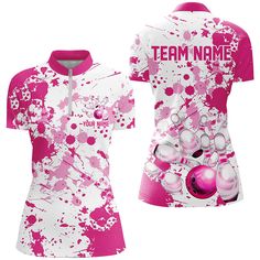 a pink and white shirt with paint splatters on it, that says team name