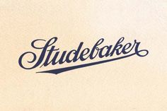 the word studebaker written in cursive ink on a white paper background