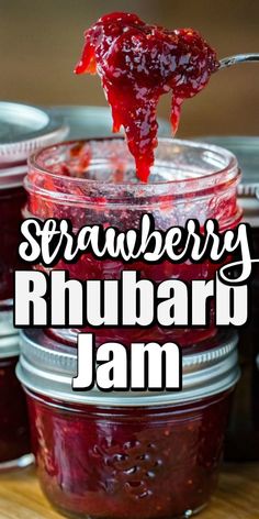 strawberry rhubarb jam is in a jar with a spoon full of jam