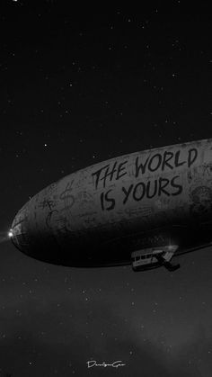 an old blimf with the words the world is yours written on it in black and white