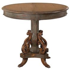 a wooden table with an ornate design on the top and bottom, against a white background