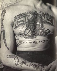 a man with many tattoos on his chest