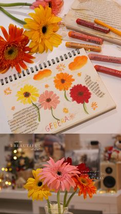 flowers are in a vase with pencils on the table and an open notebook next to it