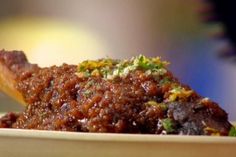 a close up of food in a bowl on a table with blurry backround