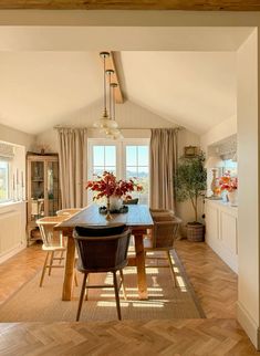 the dining room table is surrounded by chairs