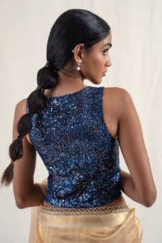 Blue silk brocade waistcoat blouse with sequin clusters embroidery. - Aza Fashions Festive Sleeveless Glamorous Choli, Festive Glamorous Sleeveless Choli, Embellished Sleeveless Party Blouse, Sequined Choli For Celebrations, Sleeveless Party Wear Tops For Reception, Sleeveless Party Tops For Reception, Party Wear Sleeveless Sequined Blouse Piece, Sleeveless Sequin Party Blouse, Sleeveless Sequined Blouse For Diwali