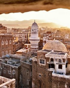 an old city is shown from the top of a building in the middle of the desert