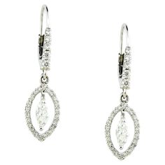 Introducing our elegant Drop Earrings, a perfect blend of simplicity and sophistication. These stunning earrings feature a total of 0.39 carats of sparkling white round diamonds and 0.43 carats of exquisite marquise-shaped white diamonds. The combination of round and marquise diamonds creates a unique and captivating design that adds a touch of elegance to any outfit. Crafted in luxurious 18K white gold and weighing 2.92 grams, these earrings are designed for comfort and everyday wear. Their und Diamond Drops, Diamond Drop Earrings, Marquise Diamond, Stunning Earrings, White Diamonds, White Diamond, Diamond White, Beautiful Earrings, Round Diamonds