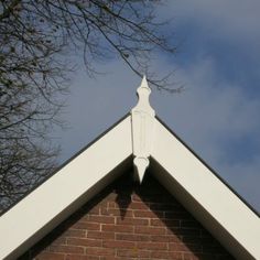 the top of a building with a clock on it